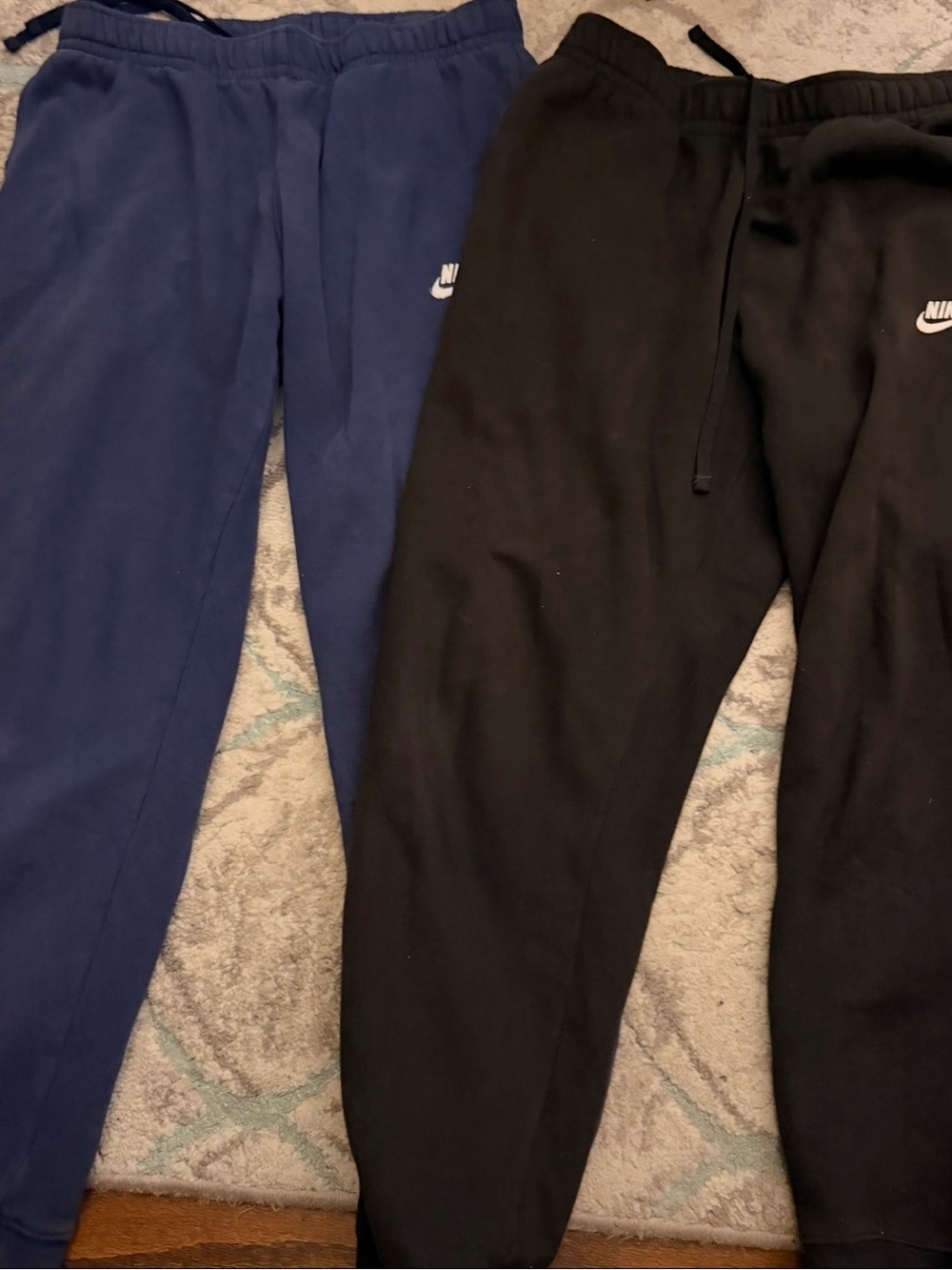2 pairs of Nike men joggers size M.